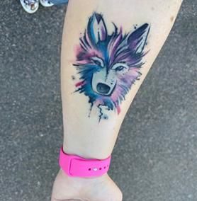pastel wolf tattoo reading